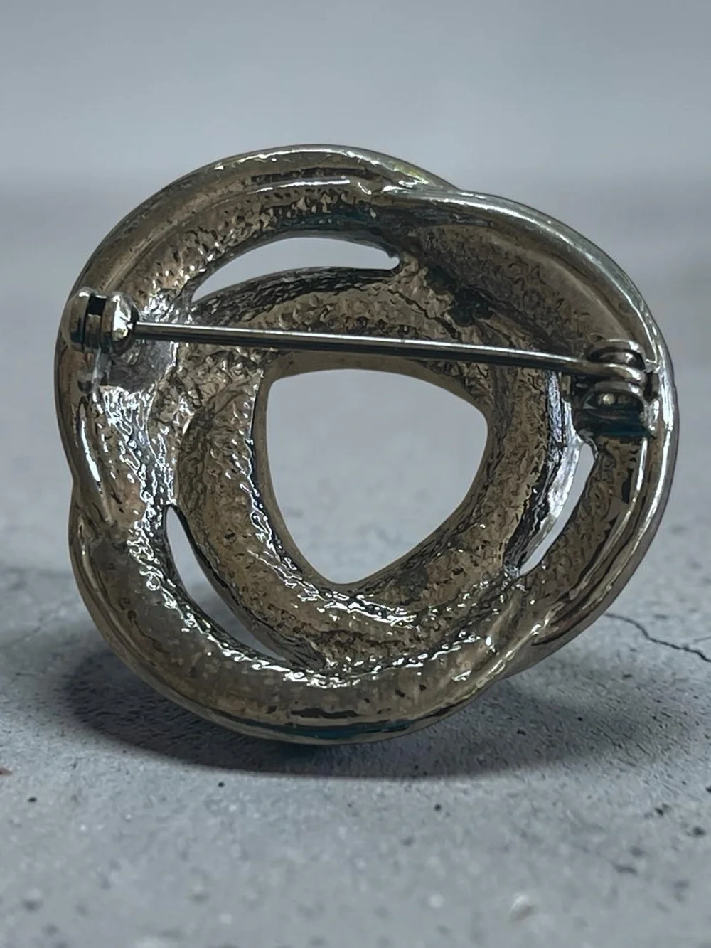 Luminous Ice Blue Crystal Gunmetal Knot Brooch Pin